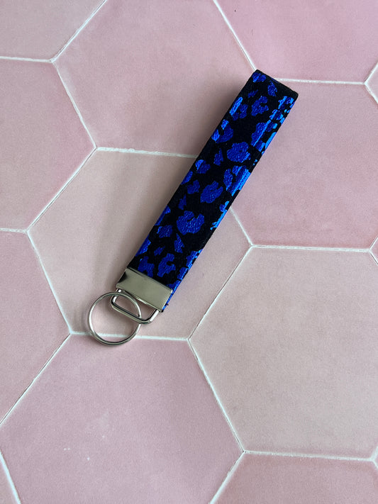 Handmade black and blue foil leopard print wristlet keychain with silver hardware, stylish fabric key holder, small business accessories UK