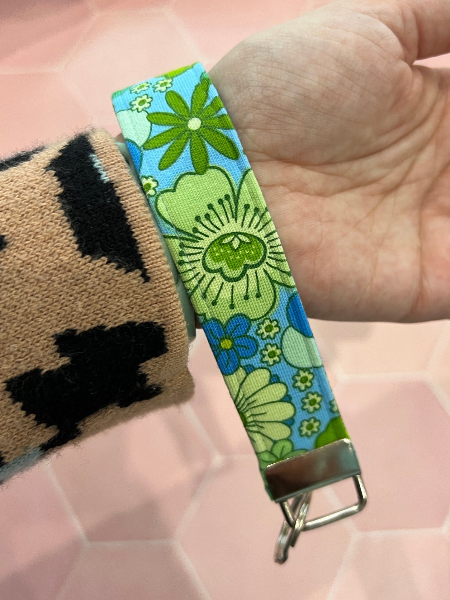 Blue Flower Child Wristlet Keychain on wrist