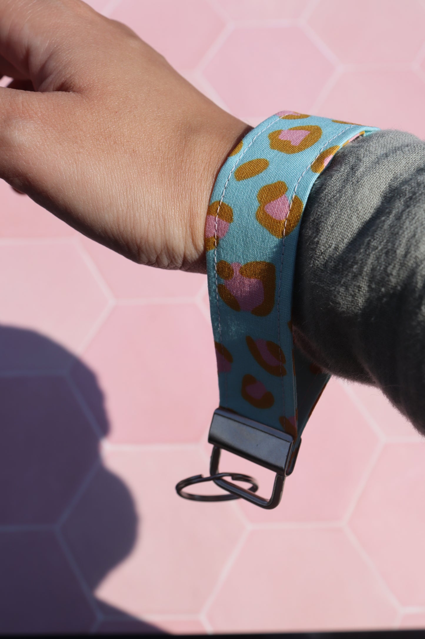 Blue and Pink Leopard Print Wristlet Keychain on wrist