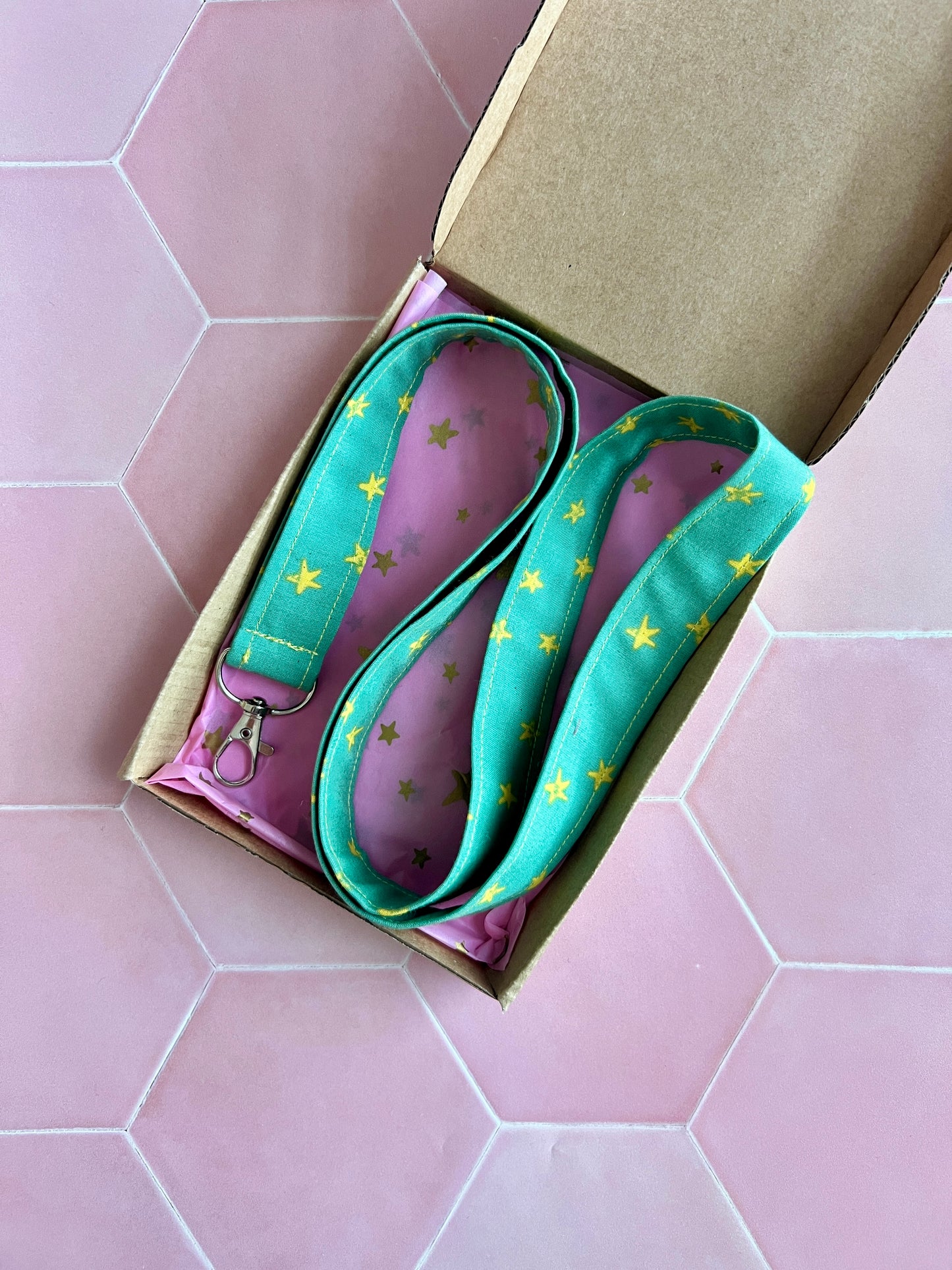 Green and yellow starry lanyard with D-ring, handmade and gift-wrapped in kraft box with pink star tissue paper, UK small business gift
