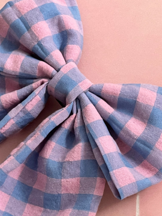 Seersucker Pink and Purple Stripe Long Tail Hair Bow up close.