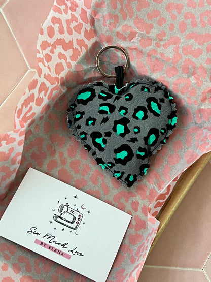 Up close of Snow Leopard Print Fabric Heart Keyring