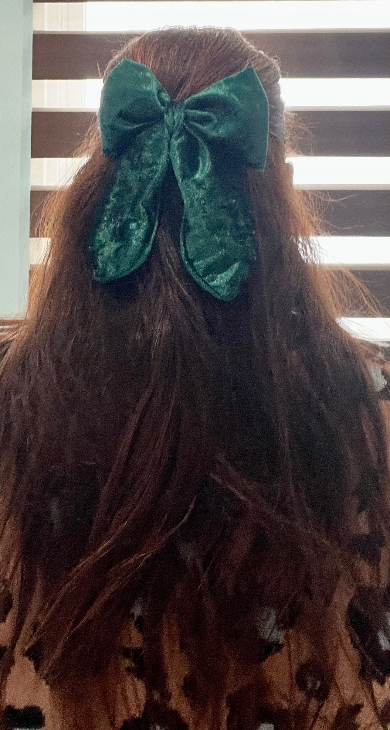 owner of sew much love wearing green velvet hair bow 