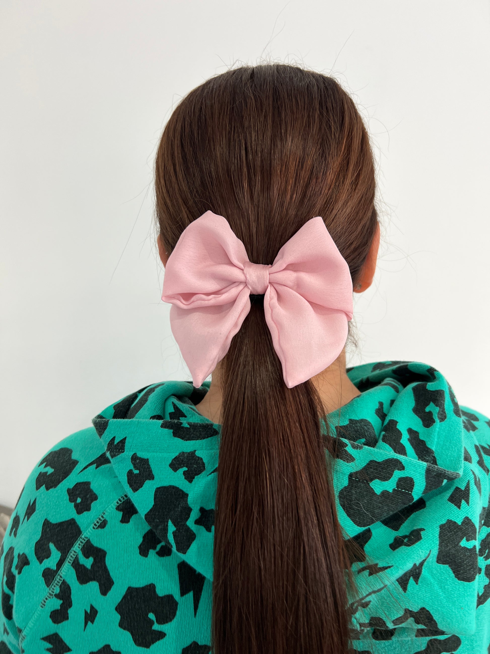 Owner of Sew Much Love wearing Pink Silk Hair Bow