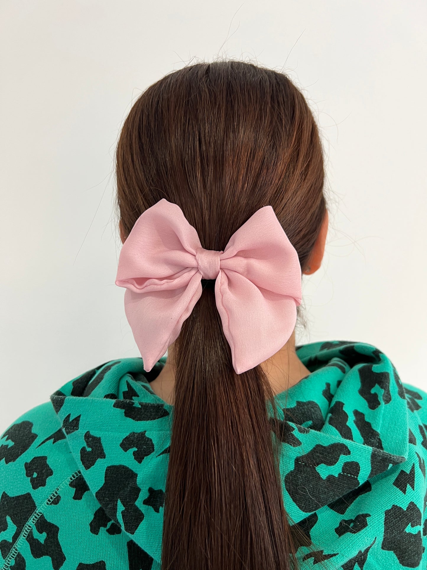 Owner of Sew Much Love wearing Pink Silk Hair Bow